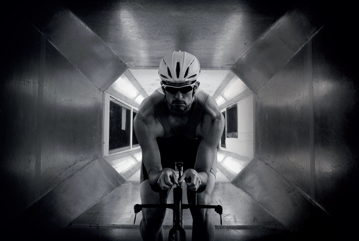 a man is testing the aerodynamic in the wind tunnel